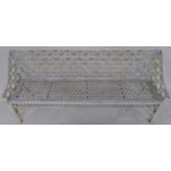 A 19TH CENTURY WHITE PAINTED CAST IRON GARDEN SEAT decorated with a trellis pattern, 91cm high,