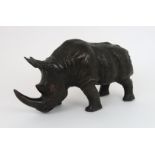 A BRONZE OF A RHINO hollow cast, 38cm long Condition Report: Available upon request