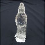 A CHINESE ROCK CRYSTAL CARVING OF GUANYIN standing and wearing flowing robes and holding a basket of