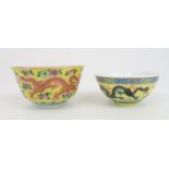 A CHINESE YELLOW GROUND BOWL painted with twin dragons amongst flowers, red seal mark, 10cm diameter