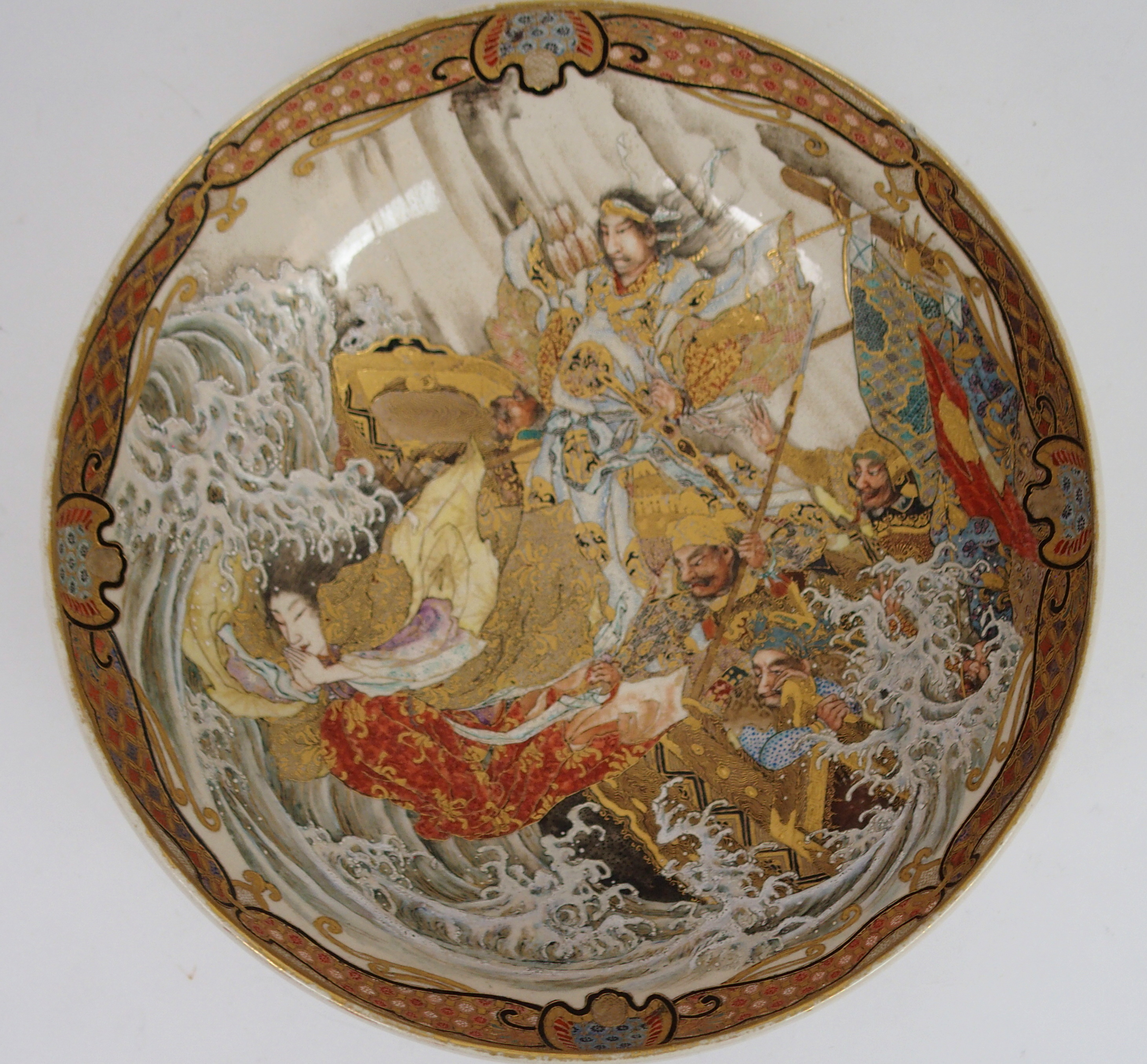 A SATSUMA BOWL painted with Shinto Gods amongst crashing waves within a border of stylised