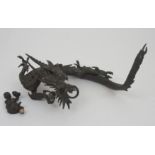 A JAPANESE BRONZE MODELL OF A DRAGON the sinuous beast holding a crystal ball, 30cm long and a