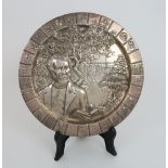 A SOUTH AFRICAN SILVER PLATE marked silver, CAS & stamped 97 on the underside, of circular form, the