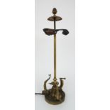 A GILDED METAL TABLE LAMP the reeded column pineapple finial and three bulb holders, the base with