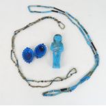 AN EGYPTIAN BLUE GLAZED SHABTI 10cm high, two Egyptian ceramic glazed necklaces, 51cm long and a