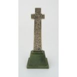 *WITHDRAWN* AN ALEXANDER RITCHIE SILVERED MODEL OF MACKINNON'S CROSS, IONA upon green Iona marble