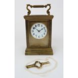 A FRENCH GILT BRASS CHIMING CARRIAGE CLOCK the white dial with Arabic numerals, 14cm high