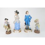 A PAIR OF CONTINENTAL 18TH CENTURY STYLE FIGURES the boy in dressed in blue holding a feathered