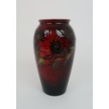 A MOORCROFT FLAMBE ANEMONE PATTERN VASE the red ground with tube line flower decoration, impressed