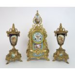A FRENCH GILT METAL CLOCK GARNITURE WITH SÈVRES STYLE PORCELAIN PANELS the dial with Roman numerals,