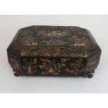 A CANTONESE BLACK AND GOLD LAQUERED SEWING BOX painted in gilts with immortals and figures beneath