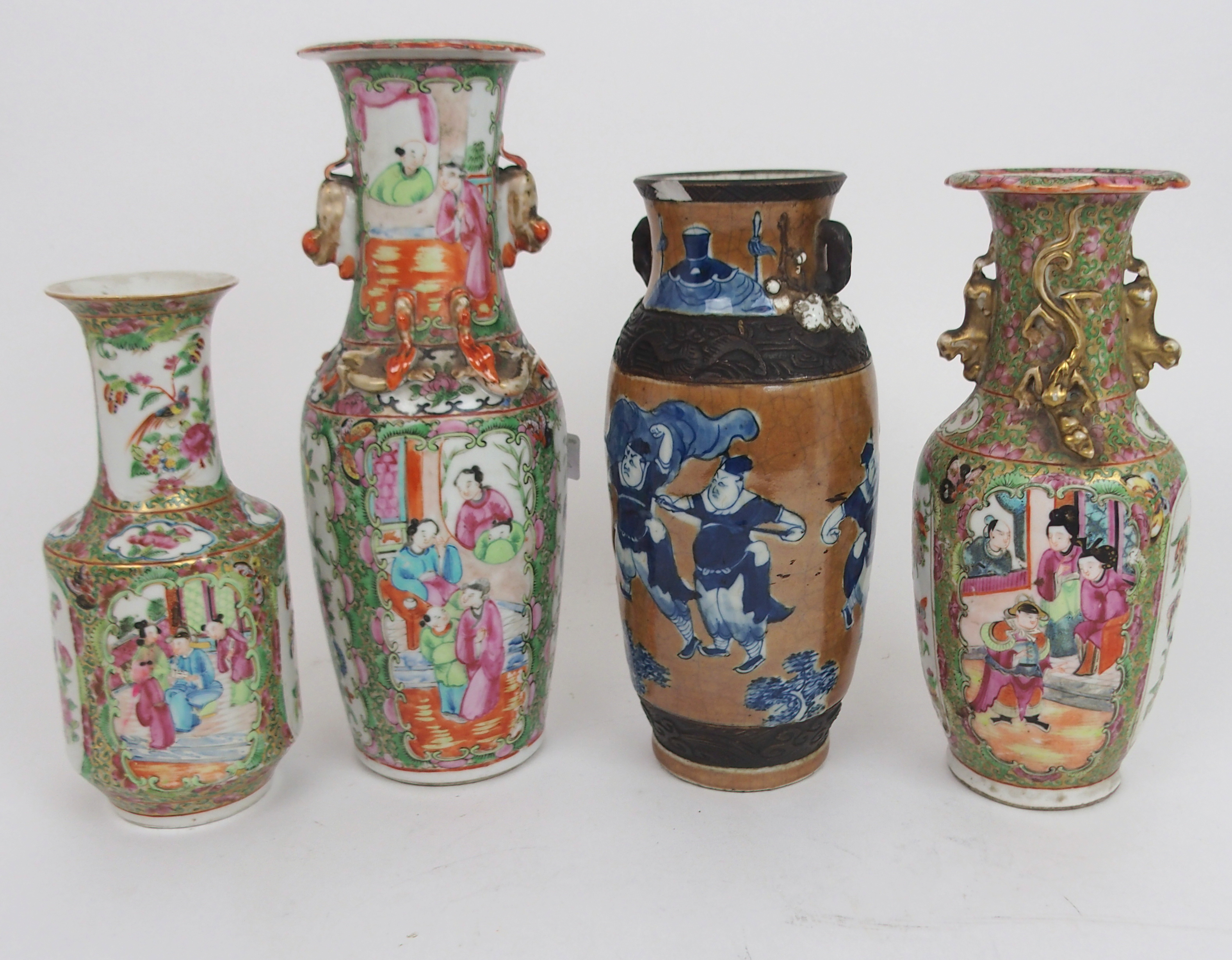 FOUR CANTONESE VASES two baluster examples with applied animals, 25 and 31cm high, another, 21.5cm