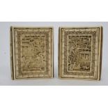 TWO CHINESE CARVED IVORY BOOK COVERS each decorated with figures in gardens amongst pavilions and
