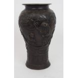 A CHINESE BRONZE BALUSTER VASE cast with a scholar and an acolyte in a sampan, within a