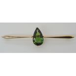 A PEARSHAPED GREEN TOURMALINE 15CT BAR BROOCH dimensions of the tourmaline approx 15mm x 9mm x