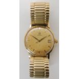 A 9CT GOLD GENTS OMEGA CIRCA 1962 with cream dial, date aperture, gold coloured hands and baton