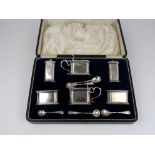 A CASED ART DECO SILVER SIX PIECE CONDIMENT SET by S W Smith & Co. Birmingham 1926 of rectangular