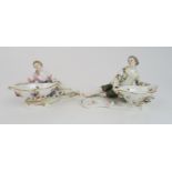 A PAIR OF MEISSEN FIGURAL TABLE SALTS with applied and painted floral decoration, blue crossed sword