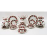 A WEMYSS TEASET painted with pink roses and foliage on a white ground comprising twelve cups,