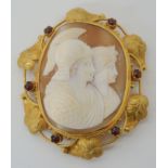 A HIGH RELIEF CARVED SHELL CAMEO OF A WARRIOR AND HIS WIFE in a bright yellow metal leaf design
