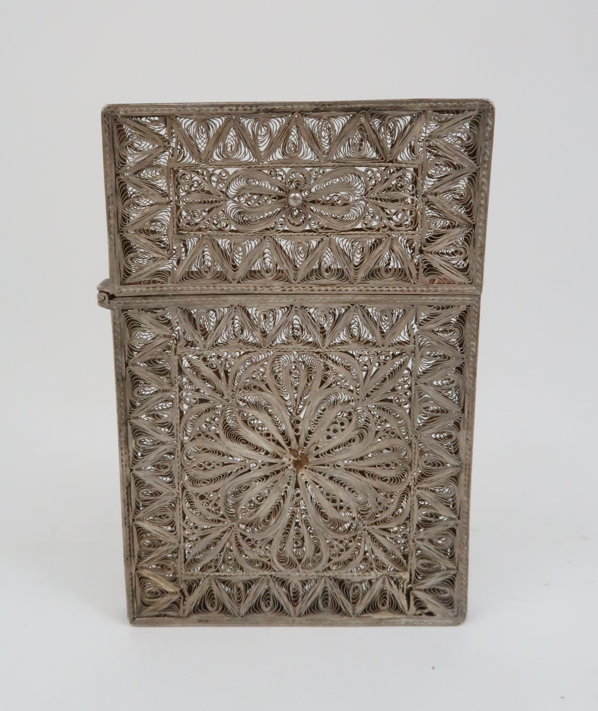 A CHINESE SILVER FILIGREE CARD CASE decorated with scrolling bands set with a shield cartouche, 9.