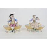 A MATCHED PAIR OF MEISSEN PORCELAIN TABLE SALTS modelled as a man and a woman in 18th century dress,