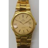 A GOLD PLATED OMEGA AUTOMATIC GENEVE WRISTWATCH with gold coloured brushed dial, gold coloured baton