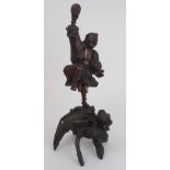 A CHINESE ROOTWOOD CARVING the standing mythical figure holding a disc and above a frog, 45cm high