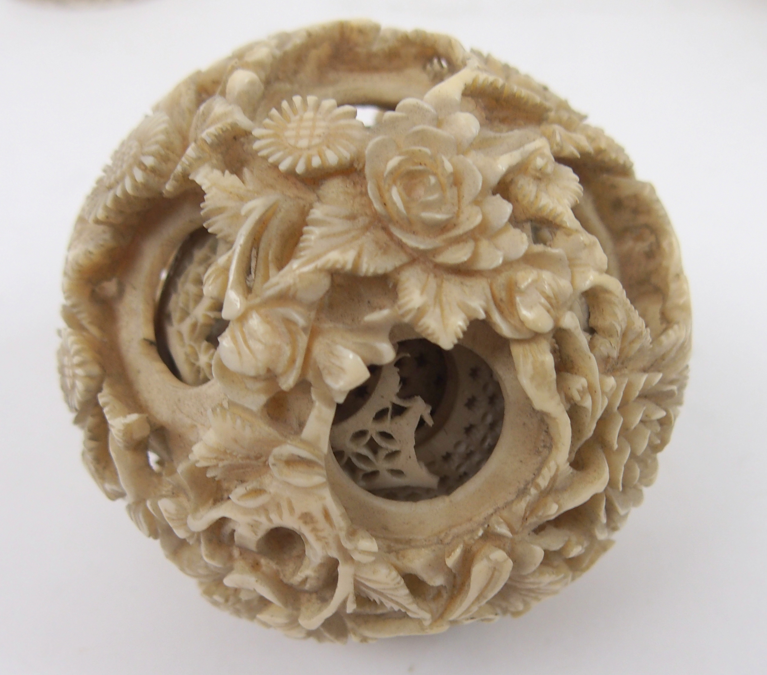 A CHINESE IVORY CONCENTRIC BALL AND A STAND 21.5cm high, a ball carved with foliage, 12cm - Image 8 of 10