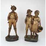 GOLDSCHEIDER FIGURE OF A BOY AND GIRL modelled walking, indistinct signature to side, 51cm high,