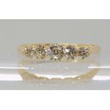 AN 18CT GOLD FIVE STONE DIAMOND RING set with estimated approx 0.45cts of old cut diamonds, in