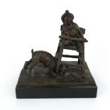 A BRONZE OF A CHILD IN HIGH CHAIR with a dogs at the base feet eating scraps, indistinctly signed,