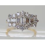 AN 18CT GOLD DIAMOND CLUSTER RING set with estimated approx 1.50ct of baguette and brilliant cut
