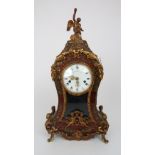A FRENCH BOULLE MANTLE CLOCK with gilt metal mounts, the white enamel dial with Roman numerals,