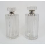 A PAIR OF ASPREY SILVER MOUNTED CRYSTAL DECANTERS the body of cut ribbed form with a flattened