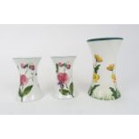 A WEMYSS WARE WAISTED VASE decorated with buttercups, 15.5cm high and a pair of smaller waisted