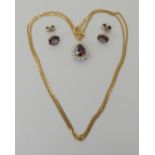 A RED GEM AND DIAMOND PENDANT WITH A PAIR OF EARRINGS the pendant is in bright yellow metal with