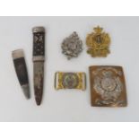 A LOT COMPRISING A 93rd. ARGYLL & SUTHERLAND HIGHLANDERS CROSS BELT PLATE with two cap badges, a