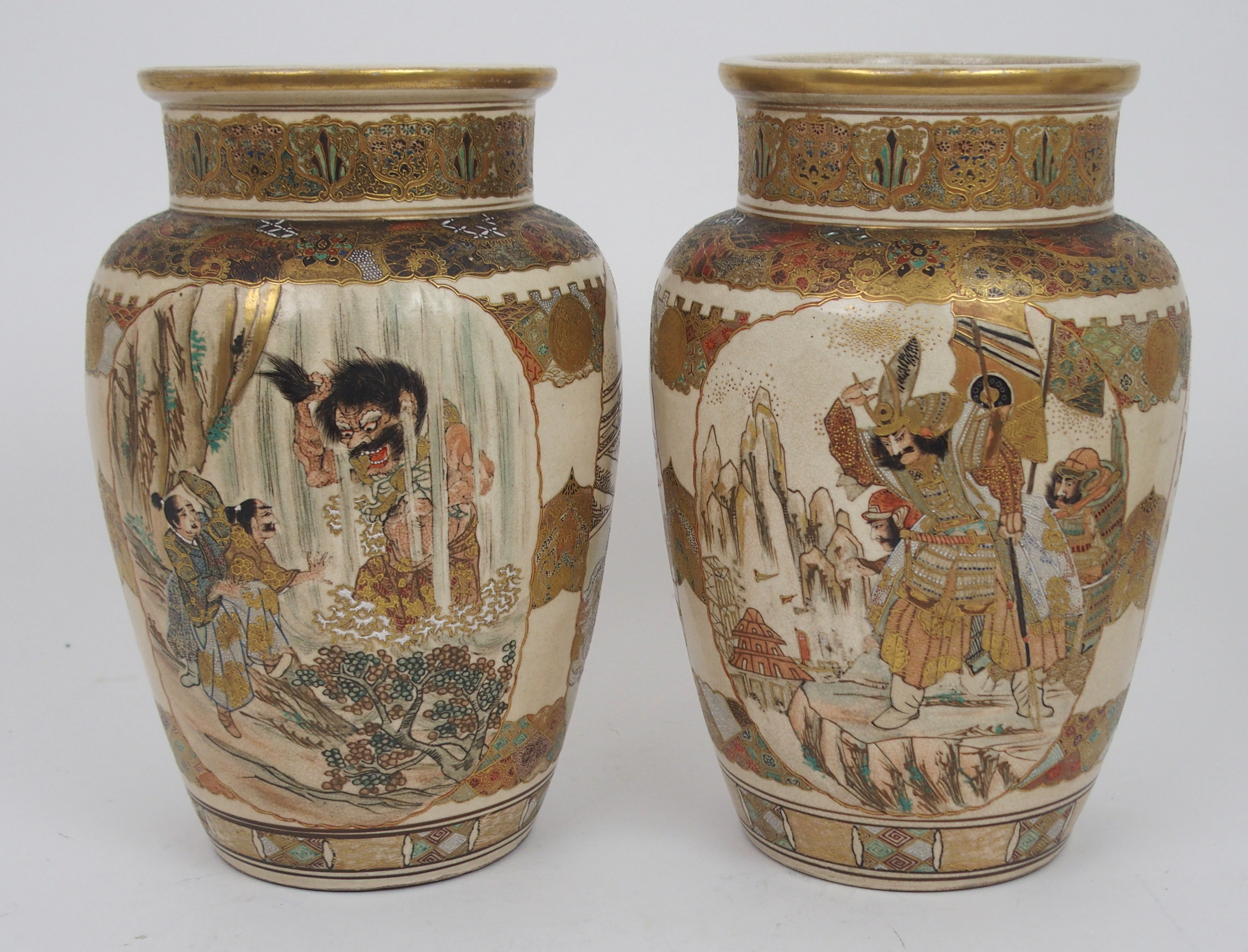 A PAIR OF SATSUMA BROAD BALUSTER VASES painted with panels of Samurai divided by foliate