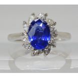 A PLATINUM SAPPHIRE AND DIAMOND RING made by Blair & Sheridan, the 8.2 x 5.9 x 3.5mm sapphire is