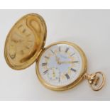 A 14K GOLD WALTHAM FOB WATCH with a decorative white enamelled dial with gold star and scroll