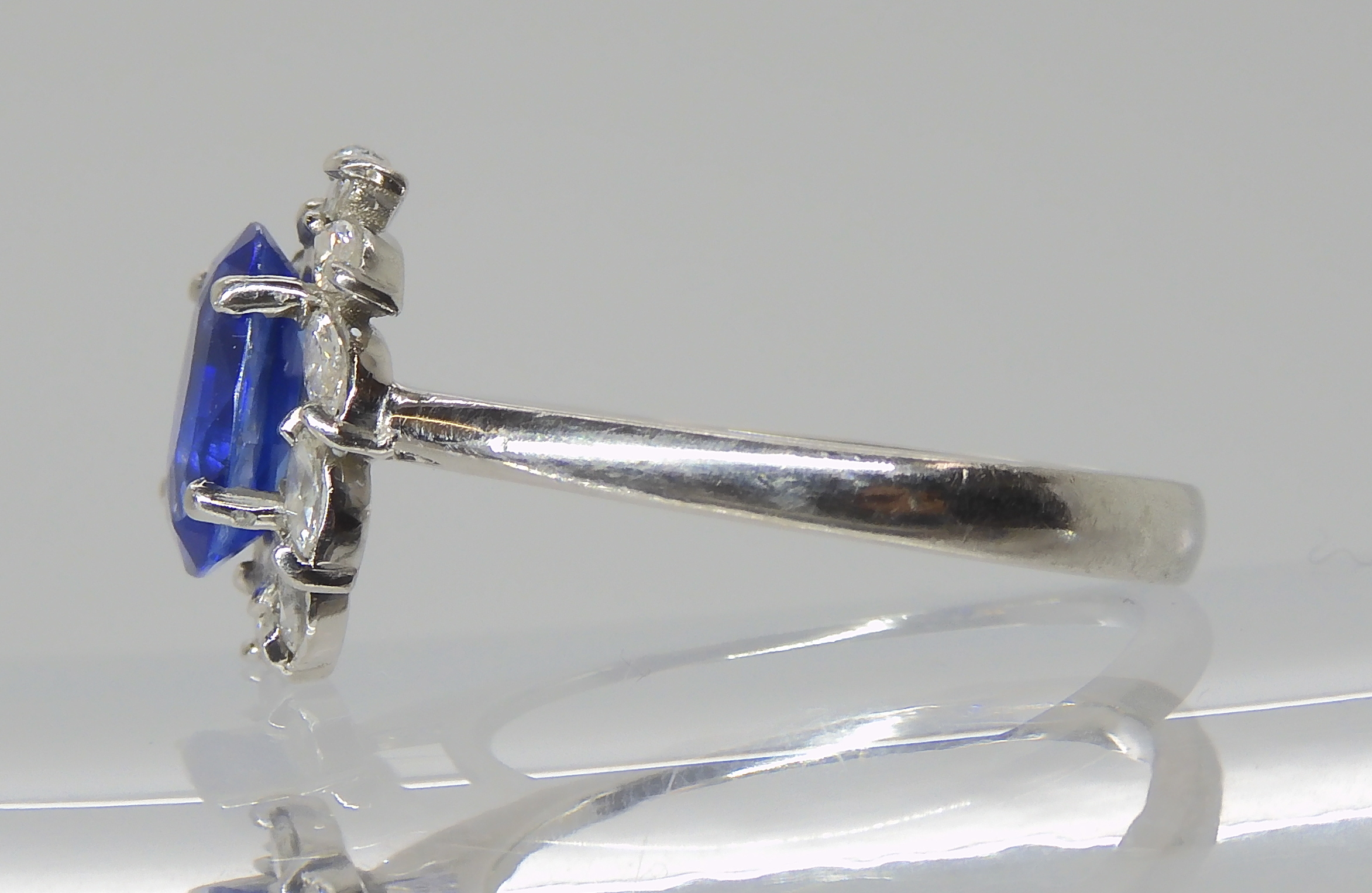 A PLATINUM SAPPHIRE AND DIAMOND RING made by Blair & Sheridan, the 8.2 x 5.9 x 3.5mm sapphire is - Image 5 of 5