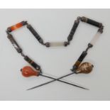 A VICTORIAN AGATE SET DOUBLE PIN AND CHAIN the two pins are linked together with a hexagonal section