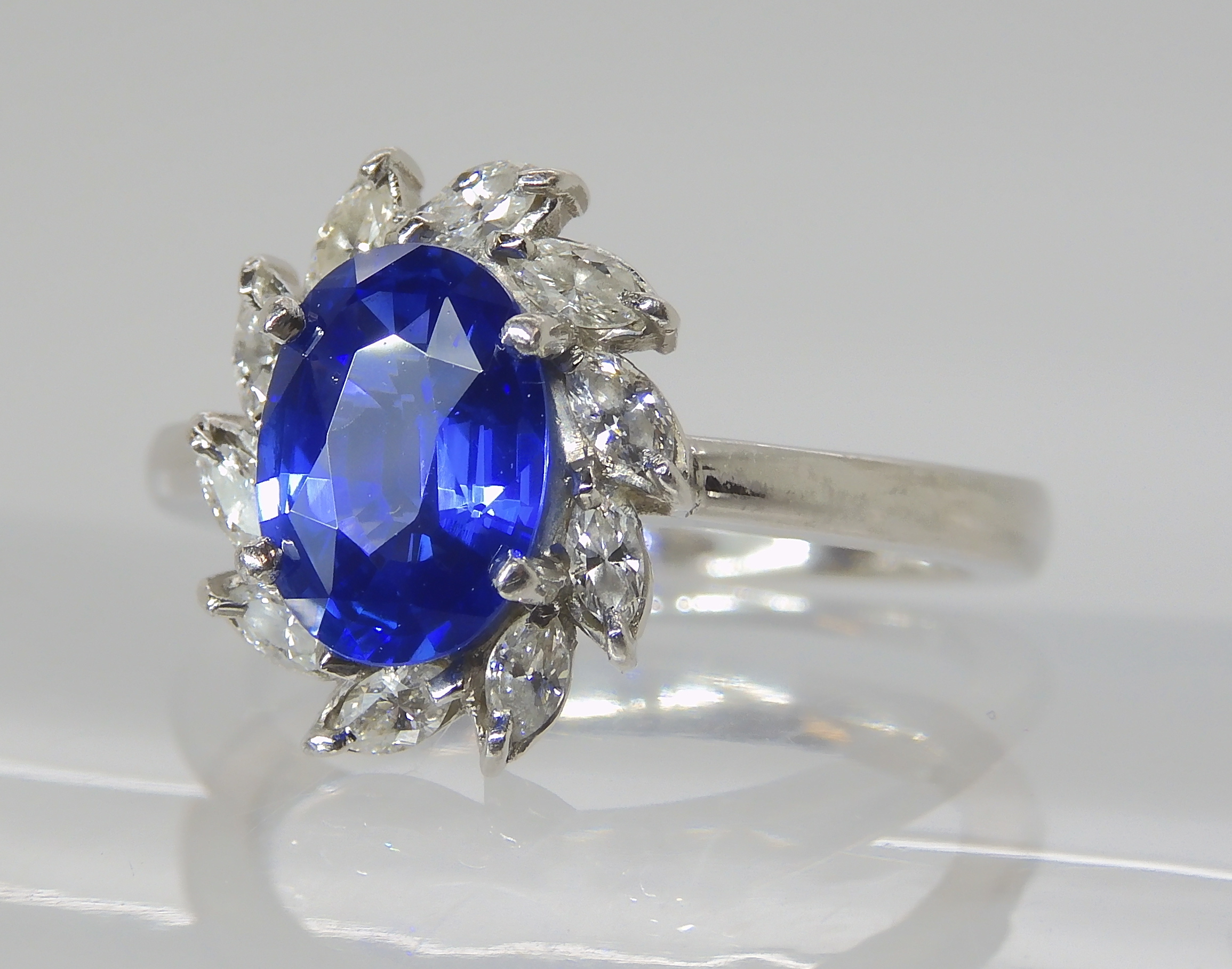 A PLATINUM SAPPHIRE AND DIAMOND RING made by Blair & Sheridan, the 8.2 x 5.9 x 3.5mm sapphire is - Image 3 of 5