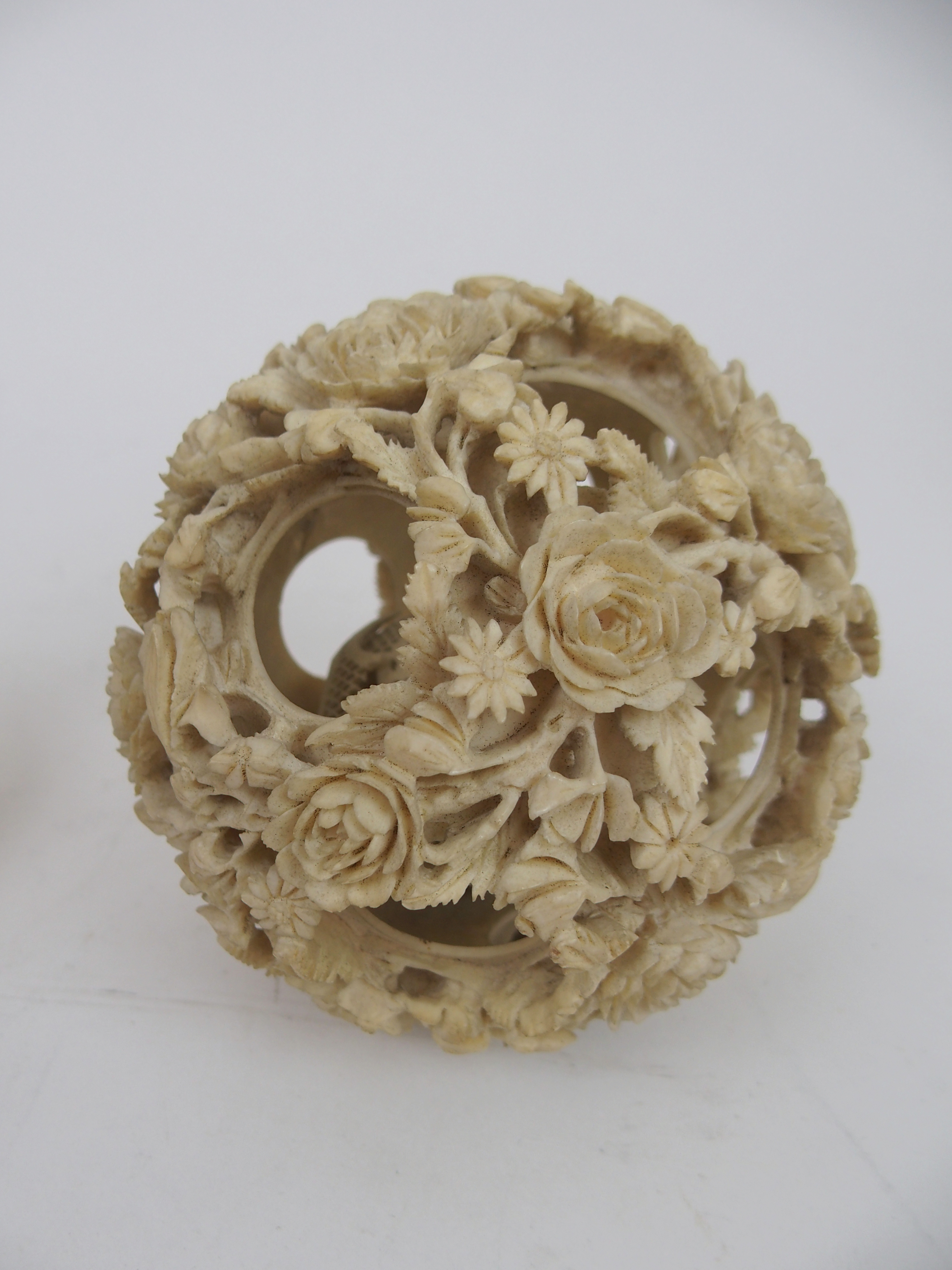 A CHINESE IVORY CONCENTRIC BALL AND A STAND 21.5cm high, a ball carved with foliage, 12cm - Image 2 of 10