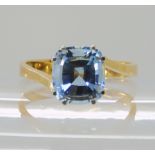AN 18K GOLD AQUAMARINE RING the aquamarine measures approximately 9.2mm x 8.5mm x 6.1mm, finger size
