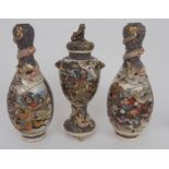 A SATSUMA GARNITURE OF THREE VASES painted with Scholars and Samurai, the vases with coiled