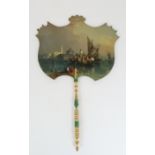 A PAPIER MACHE FAN with painted scene of Murano, with turned and painted gilt and green handle, 40cm