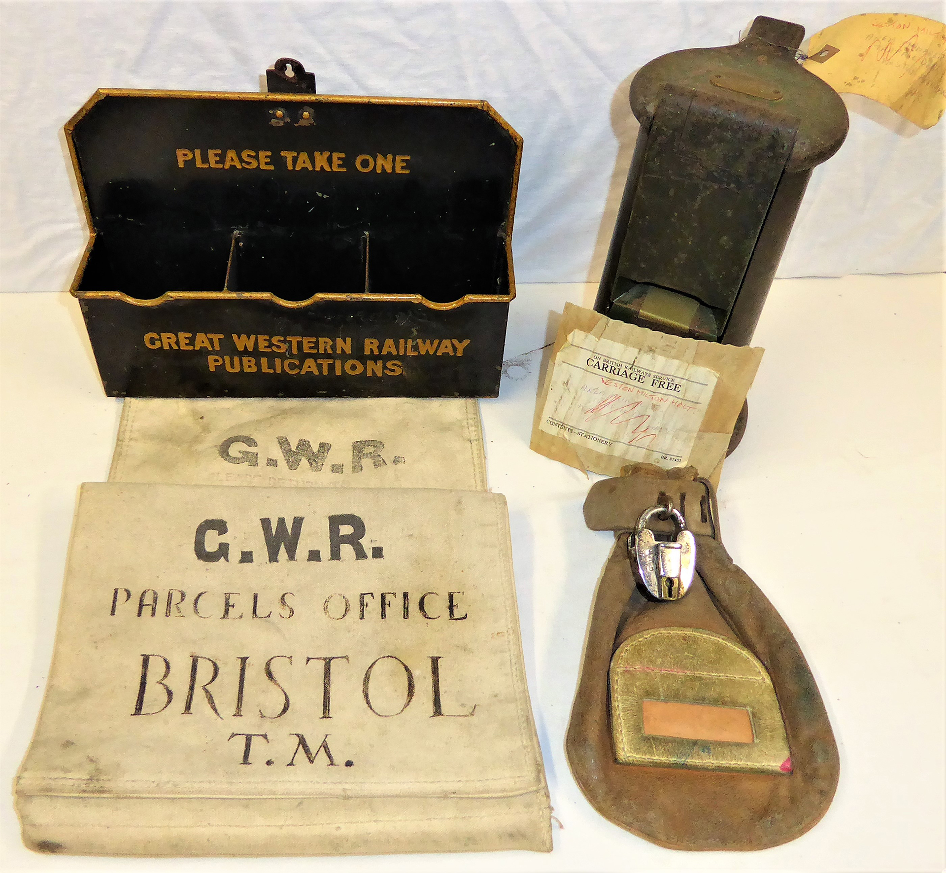 A Lot containing Railway Station items. Canvas cash bag complete with GWR stamped lock. Edmondson