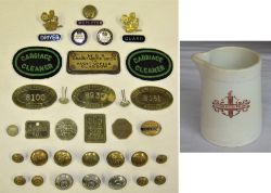 A Lot containing a collection of Badges, Buttons and pay checks in addition to other items including